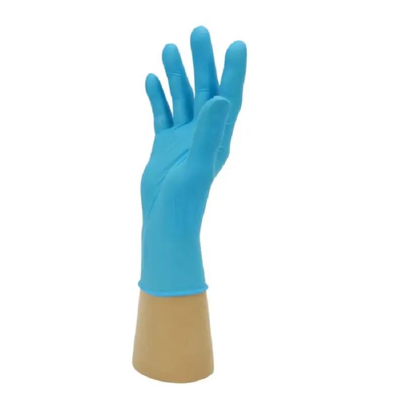 Close-up of Bodyguards GL895 Blue Nitrile Glove on hand showing textured fingertips for enhanced grip.