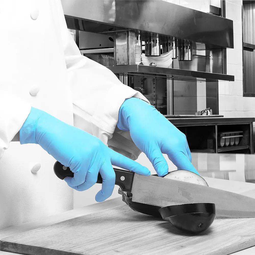 Bodyguards GL895 Blue Nitrile Disposable Gloves being used in a professional workspace.