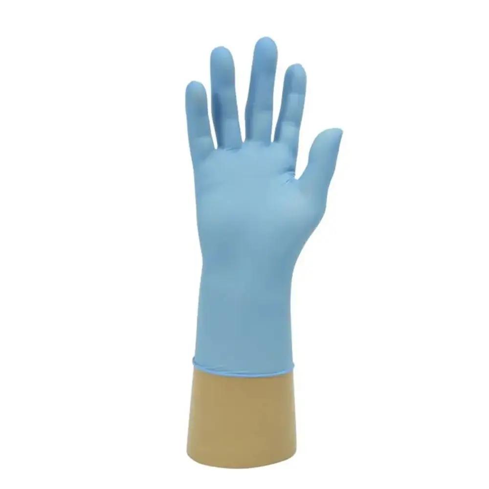 Close-up of Palm blue Shield GD19 nitrile glove showing the textured fingertips for enhanced grip and the beaded cuff for easy donning.